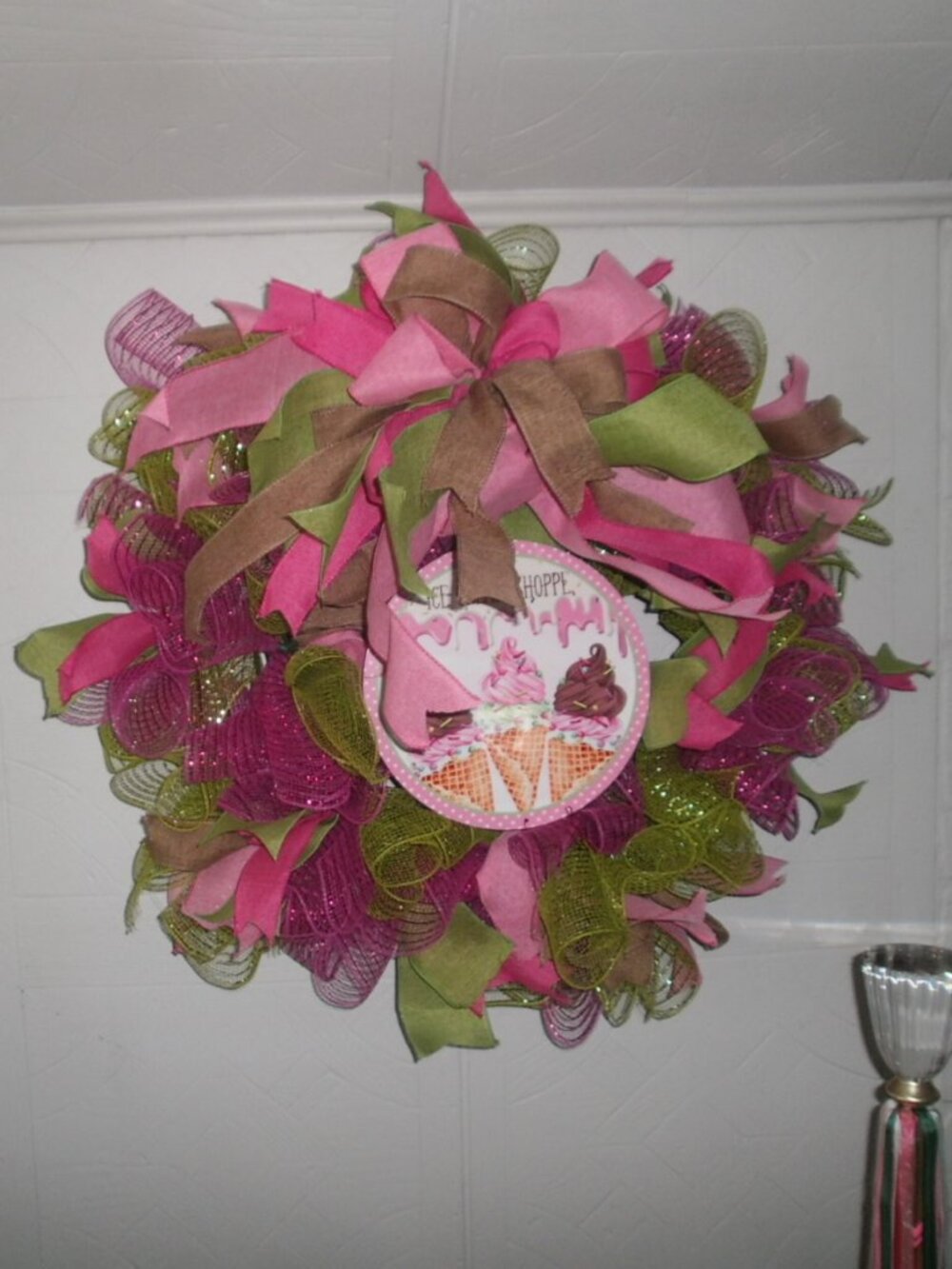 Wreath approximately 24"X24" round pinks and greens/Ice cream wreath